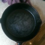 Is black residue on cast iron bad?