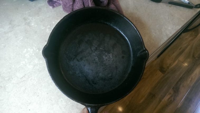 Is black residue on cast iron bad?