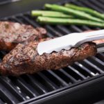 Is cast iron or stainless steel better for searing?