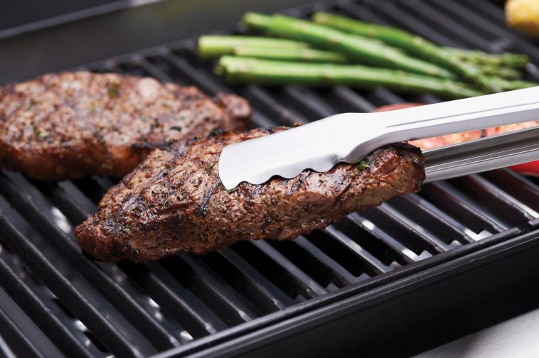 Is cast iron or stainless steel better for searing?