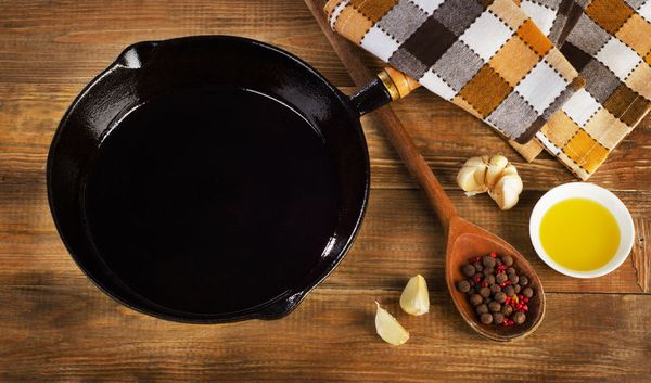 Is it OK to season cast iron with olive oil?
