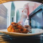 Is it better to reheat food in oven or microwave?