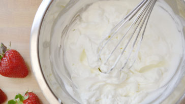 Is it better to whip cream in a glass or metal bowl?