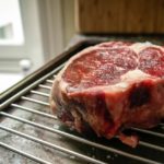 Should I grill steak covered or uncovered?