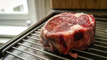 Should I grill steak covered or uncovered?