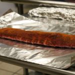 Should I wrap ribs in foil when grilling?
