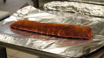 Should I wrap ribs in foil when grilling?