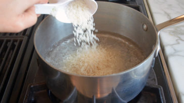 Should you boil water before adding rice?