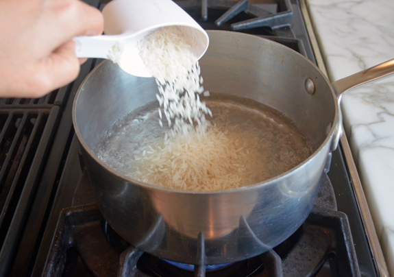Should you boil water before adding rice?