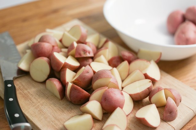 Should you cut potatoes before boiling for potato salad?
