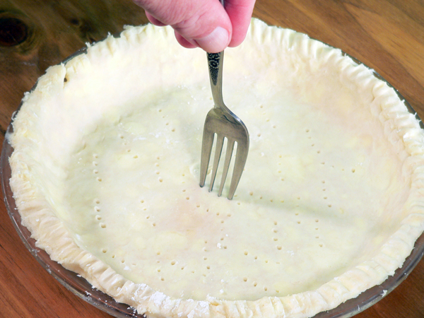 Should you poke holes in bottom of pie crust?
