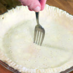 Should you poke holes in bottom of pie crust?