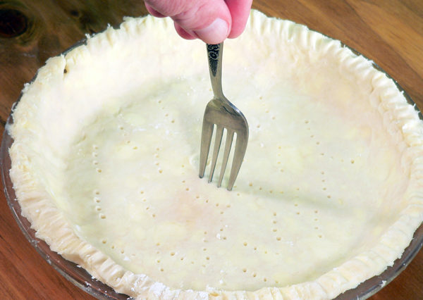Should you poke holes in bottom of pie crust?
