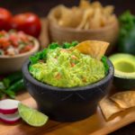 What do restaurants cut guacamole with?