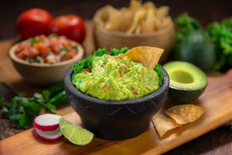 What do restaurants cut guacamole with?