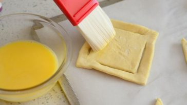 What does adding egg to pie crust do?