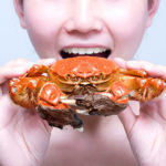 What happens if I eat undercooked crab?