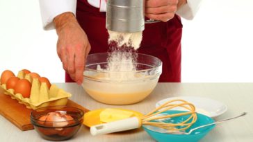 What happens if I put less sugar in a cake?