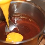 What happens if you add butter to melted chocolate?