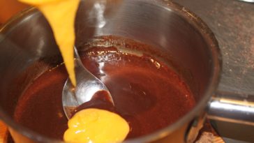 What happens if you add butter to melted chocolate?