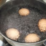 What happens if you crack an egg in boiling water?