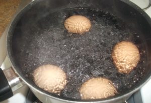 What happens if you crack an egg in boiling water?