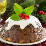 What is Christmas pudding served with?