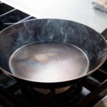 What is the best oil to season a carbon steel pan?