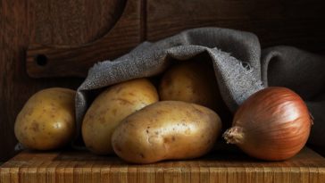 What is the best way to store potatoes onions and garlic?