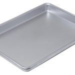 What is the difference between a jelly roll pan and a cookie sheet?