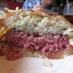 What is the secret to juicy hamburgers?