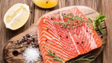 Where is farm-raised salmon banned?