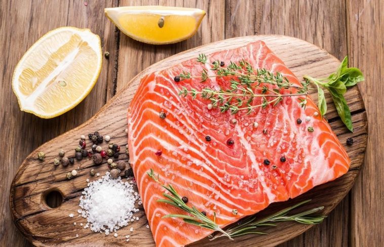 Where is farm-raised salmon banned?