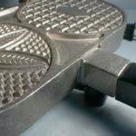 Why are my Pizzelles sticking to the iron?