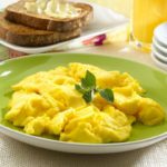 Why are scrambled eggs higher in calories?