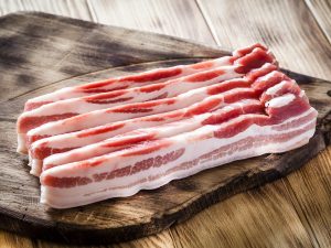 Why can you eat ham raw but not bacon?