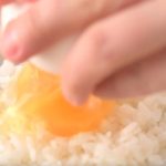 Why do Japanese put raw egg on rice?