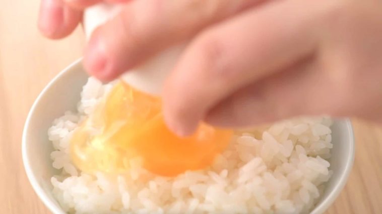 Why do Japanese put raw egg on rice?