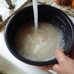 Why do Japanese wash rice?