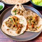 Why do street tacos have two tortillas?