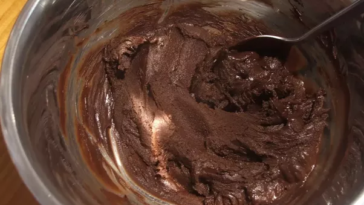 Why do you add butter to melted chocolate?