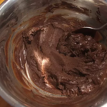 Why do you add butter to melted chocolate?