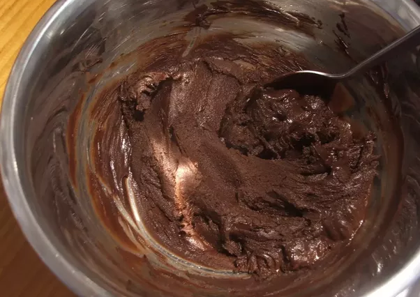 Why do you add butter to melted chocolate?