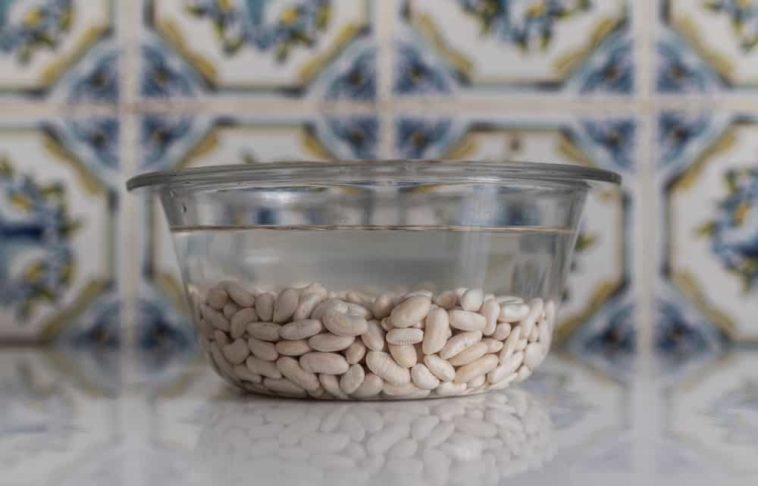 Why do you discard bean soaking water?