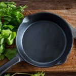 Why does my cast iron grill pan smoke?