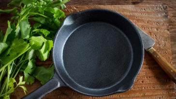 Why does my cast iron grill pan smoke?