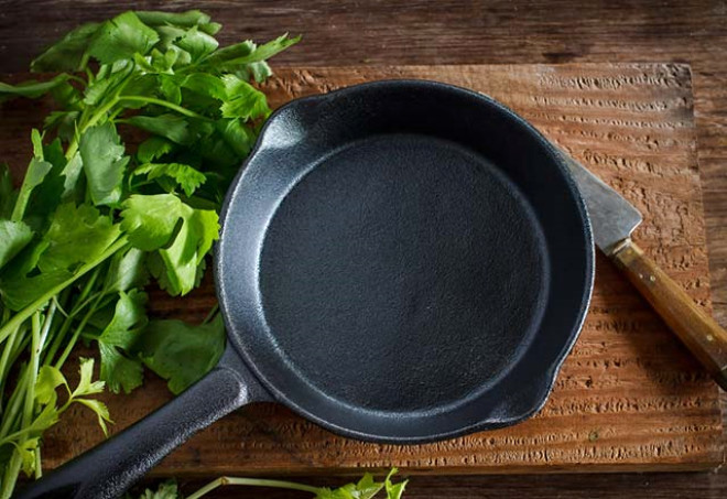 Why does my cast iron grill pan smoke?