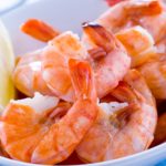 Why does shrimp turn pink when cooked?