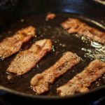 Why is my cast iron sticky after seasoning?