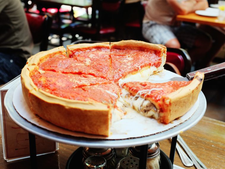 Why is the sauce on top of deep-dish pizza?